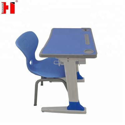 China Environmental Friendly Trapeze School Desk And Chair Kids Study Teen Table And Chairs for sale