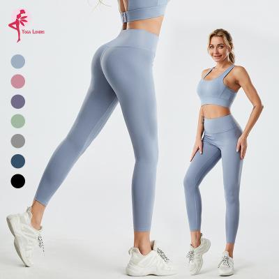 China Hot Sale High Waist Fitness Trainer Yoga Pants Butt Lifting Tights Quick Dry Seamless Wholesale Breathable Gaiters for sale