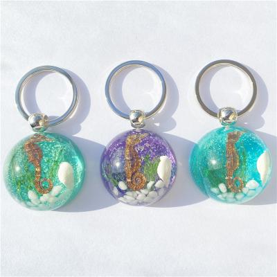 China New Resin Shiny Creative Resin Natural Amber Navy Epoxy Handmade Key Chain for sale