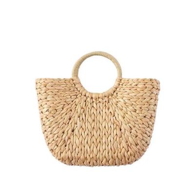 China Hand Made Beach Straw Bag Travel Straw Bag Women Holiday Corn Weave Handle Lady Summer Fashion Round Casual Bohemian Semicircle Skin Bag for sale