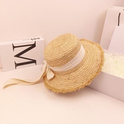 China 2022 Raw Image Brim Bowknot Ribbon Cowboy Cap Paper Flat Men Panama Hat Wide Straw Hat for sale