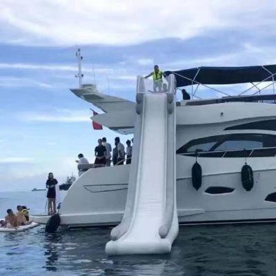 China Custom PVC Firstents Inflatable Sea Slide House Boat Slide Inflatable Yacht Floating Slide for sale