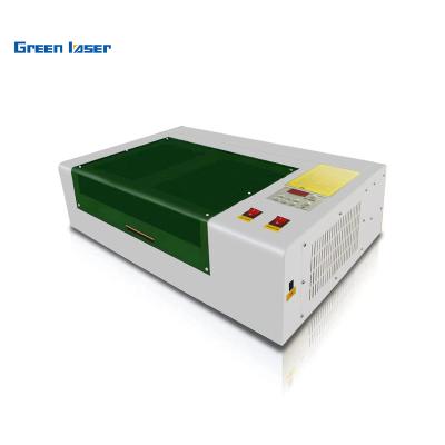 China Water Cooled Professional Laser Engraving Machine 40W CO2 3020 Laser Cutting Machine With Exhaust Fan USB Port for sale