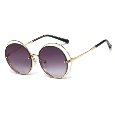 China Fashion Sunglasses 2021 Trendy New Frame Metal Mirror Foot Sunglasses Round Drill Sunglasses for sale