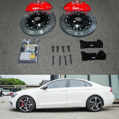 China 4 Piston Racing Caliper VW big Brake Kit 355*28 MM High Carbon Disc Racing And Brake Pads For Lamando 18 Inch Rim for sale