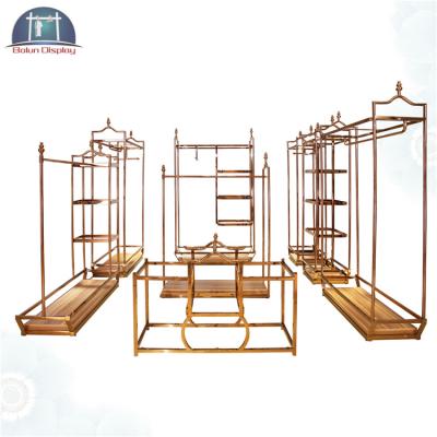 China Elegant and Graceful Rose Gold Metal Display Rack Clothing Store Clothing Store Display Furniture for sale