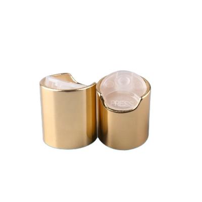 China Non Spill 24/410 Gold Aluminum Plastic Flip Top Cap For Shampoo And Shower Gel Bottles for sale