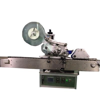 China Food desktop horizontal roll labeling machine long cylinder bottle self adhesive labels labeling machine for sale