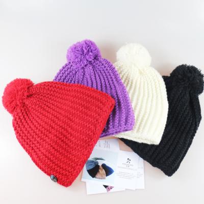 China COMMON wool pom pom women beanie hats fashion and warm sale women winter hats for sale