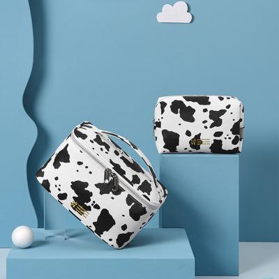 China New Large Capacity Cow Printing Travel Bag Women Multifunctional Waterproof Cosmetic Toiletry Bag Portable Organizer Pouches Storage Handbag for sale