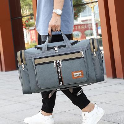 China Multifunctional Purpose Canvas Men Travel Portable Outdoor Duffel Bags To Carry Luggage Bags Women Weekend Bag Large Capacity Travel Handbags for sale