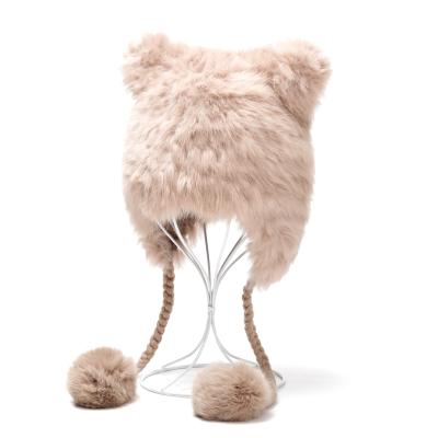 China Ladies winter rabit fur waterproof earflap hats with fur pompom balls for women for sale