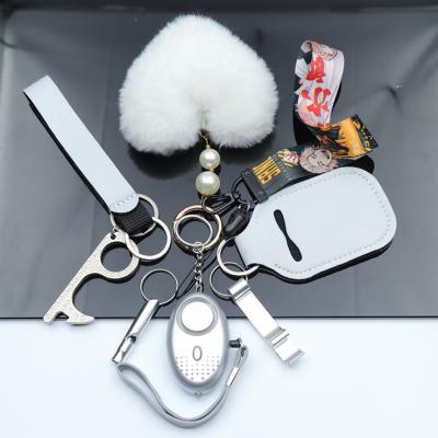 China Metal Key Chain Checked Manufacturer Aluminum And Iron Hardware Wholesale Defense Key Chain With Fur Ball for sale