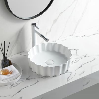 China Wired Bad Easy Cleaning White Ceramic Wash Basin Table Top Basin Waschbecken Modern Irregular Counter Basin for sale