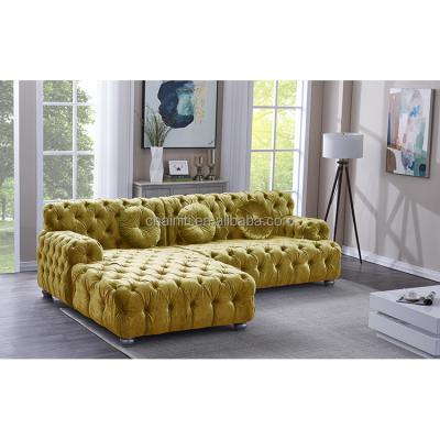 China Modern Luxury Fabric Tufted Sofa Set With Tufted Button Living Room Interior Design Velvet Sectional for sale