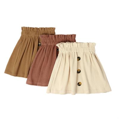 China Anti-wrinkle solid color baby girl clothing skirt elastic band one line plus size dress short skirt baby skirt with button for sale