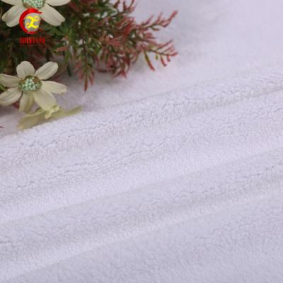 China Anti Pill Hot Sale Fleece Robe Warm White Coral Fabric For Bathrobes for sale