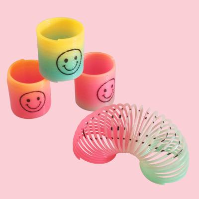 China Rainbow Spring Magic Novelty Toys Rainbow Circle With Face Mini Coil Spring Toy Magic Smile Spring 3*3.5cm for sale