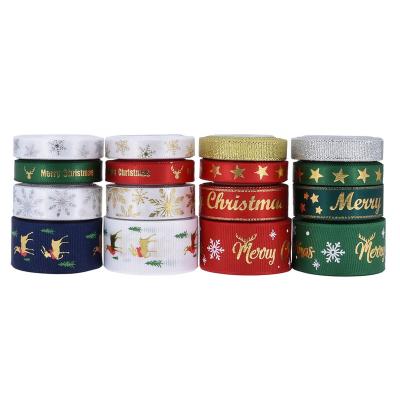 China 100% Gold or Hot Polyester Christmas Ribbon Foil Printing Beautiful Convex White Snow Metallic Ink Convex Snow Star Deer for Christmas for sale