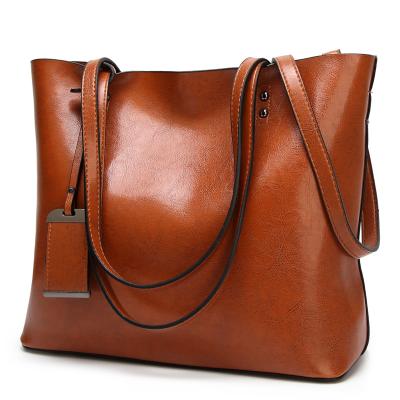 China Famous fashion women's luxury handbags bags in bulk the large purses packing vegan leather tote bag for sale