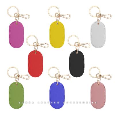 China Custom Logo Rose Gold Metal Vegan Shape PU Keychain Saffiano Key Chain Heavy Duty Leather Oval Leather Hardware for sale