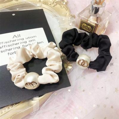 China 2022 designer fashion brand hair ties girls letter c hair accessories cc pearl elastic hair bands for sale