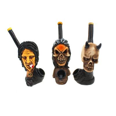 China Small Contemporary Cartoon Tobacco Hand Smoke Novelty Resin Smoking Pipe for sale