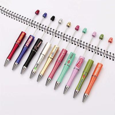 China Custom promotional free fancy ABS LOGO beadable DIY pen colorful pearl ballpoint pens rose gold plastic beadable pens for sale