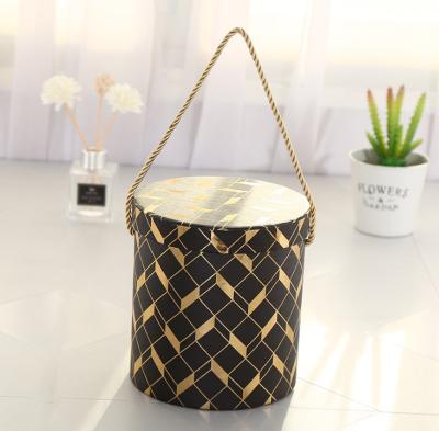 China Wholesale Recyclable Black With Gold Foil Cylinder Flower Paper Boxes Cardboard Paper Box For Wedding And Valentine's Day for sale