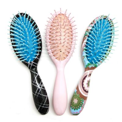 China Professional Cushion Massager Bristle Brush Water Transfer Copy Around Plastic Hair Brush for sale