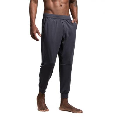 China Anti-Wrinkle OEM Men Sweatpants Outdoor Stretchy Fitness Running Loose Oversized Sports Pants for sale