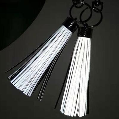 China Available Custom Soft Reflective PU Tassels Safety Decoration Sample PVC Key Chain for sale