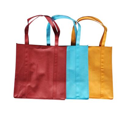 China OEM Handled Design High Quality Customized Printing Reinforced Long Handle Reusable Non Woven Bag Custom Logo for sale