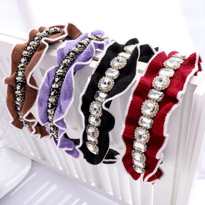 China Fashionable handmade high-end faux stone fabric headband factory flashing pure color knitted headband for sale