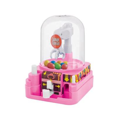 China Mini Cartoon Ball Table Machine Funny Game Candy Plastic Grabber Toys For Children for sale