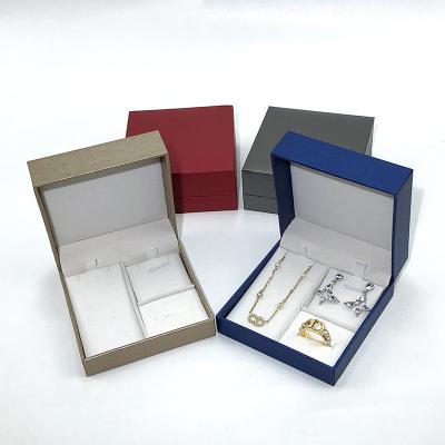 China Disposable Luxury gold OEM custom PU Leather pendant 'jewelry' box Earrings rings jewelry box With Logo for sale