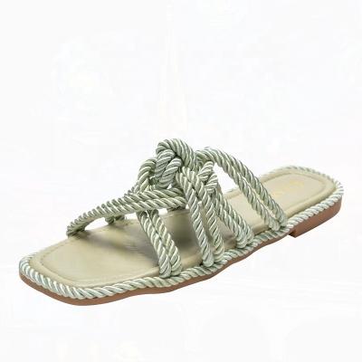 China Damping Customized 2022 New Green Woven Home Slippers Women Summer Rope Slippers Sandals for sale