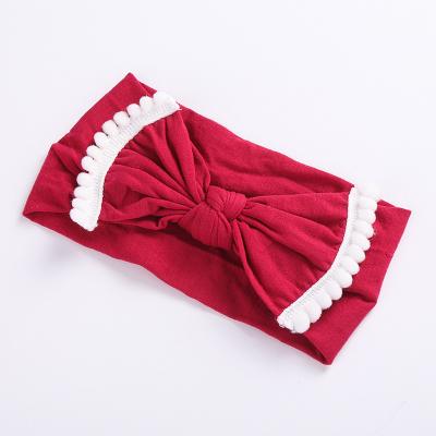 China Pom pom trim elastic headbands girls hair accessories factory sale soft nylon turban wide newborn baby headbands for sale