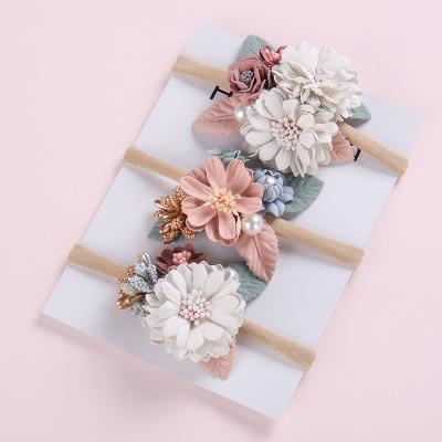 China Cute Handmade Nylon Flowers Headbands Elastic Stretchy Floral Nylon Babies Head Wraps With Pearl Vintage Headwear for sale