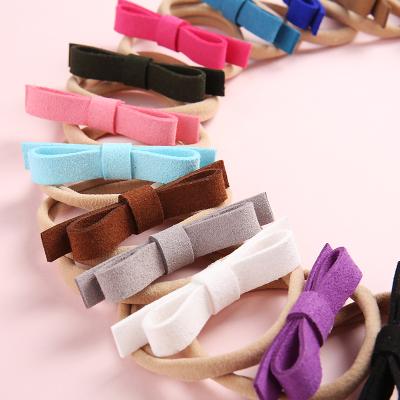 China Fashion Elastic Flock Leather Bows Nylon Newborn Girls Knotbow Hair Accessories Stretch Headbands Headbands for sale