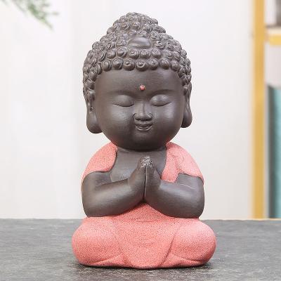 China Small Buddha Statue Ceramic Pet Tea Figurine Ornaments Stocked Ceramic Crafts Decorative for sale