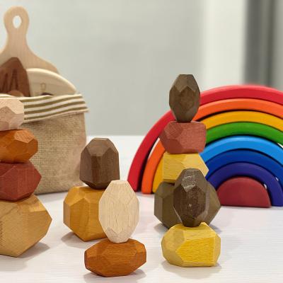 China Toy Colored Balance Wooden Stone Educational Toys Wholesale Montessori Balancing Stone Wood Rocking Toys for sale