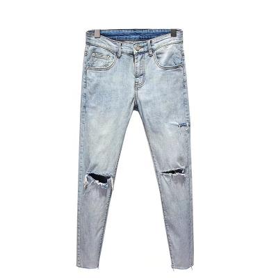 China 2022 new European and American light blue fashion elastic thin men's jeans hole pencil QUICK DRY skinny gaiters for sale