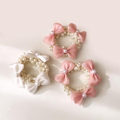 China Elegant hair decoration organza bow tie pearls cute pearl hair scrunchies girls scrunchy hair buns band fashion kids hair ties for sale