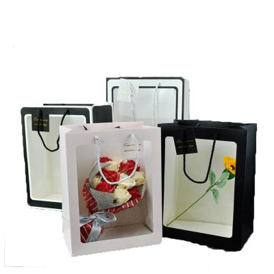 China Recycled Materials Ins Style Paper Bag Kraft Paper Transparent Flower Packing Portable Bag for sale