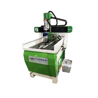 China Advertising company wood sign cutting mini cnc router 4040 advertising 6090 cnc router machine 6040 for wood crafts /plane &cylinder for sale