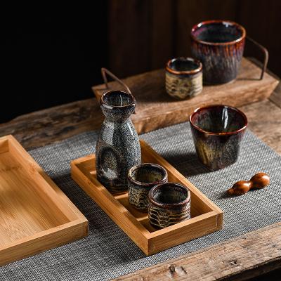 China Wholesale Minimalist Creative Porcelain Japanese Sake 4 Pieces Set Wine Pot Saki Set Japan Sake Cup with Bamboo Tray for sale