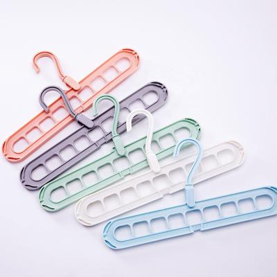 China Space Saving Modern Multi Color 9 Holes Rotating Plastic Magic Hanger for sale