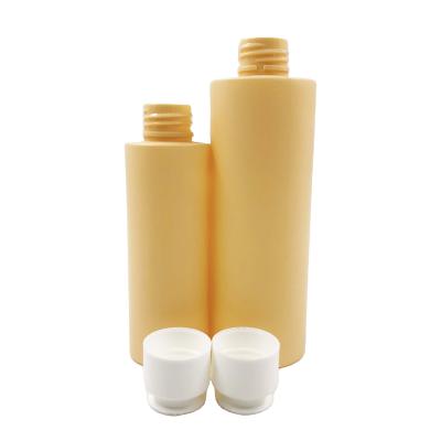 China 60ml 100ml Bright Yellow Round PET Cosmetics Packaging Bottles Set With Flip Top Cap For Replenishing Toner Skin Care Lotion for sale