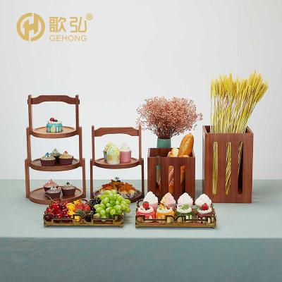 China Hotel modern luxury chinese buffet food display stand factory direct sales wooden dessert cake display fruit rack for sale